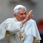 Pope Benedict XVI waves to faithful as h